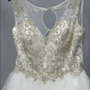 This is a brand new wedding dress never worn. A beautiful detail dress.
